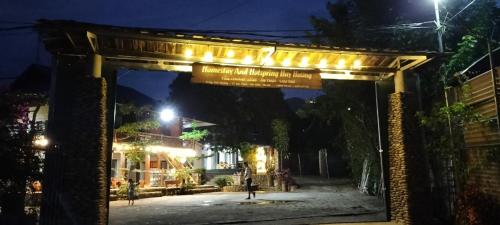 a archway with lights on a street at night at Homestay and Hots Spring Huy Hường in Yên Bái