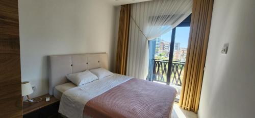 Кровать или кровати в номере AdeLion Albimo Loft