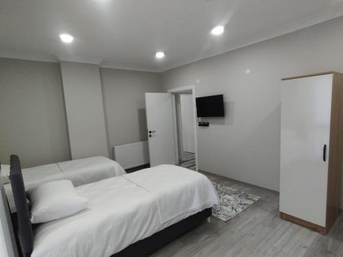 Ένα ή περισσότερα κρεβάτια σε δωμάτιο στο Thoania Apart Otel