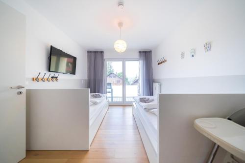 a room with two beds and a window at Apartment 104 in Feldberg