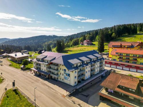 an overhead view of a building in a town with a street at Apartment 104 in Feldberg