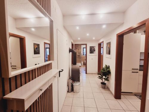 a hallway of a home with white walls and a hallway at Tom's FeWo in Pommelsbrunn