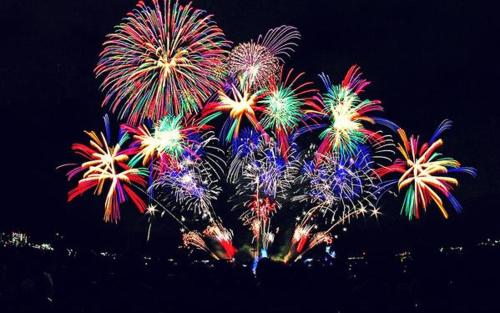 a bunch of colorful fireworks exploding in the sky at Europa Family Apartments in Blanes