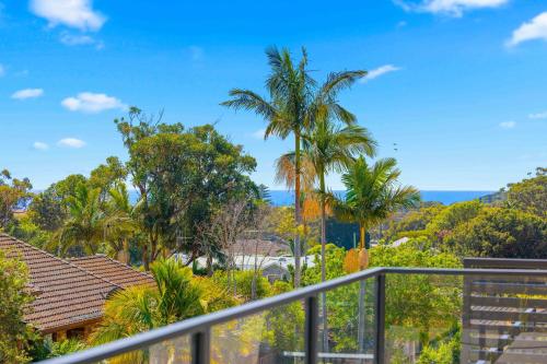 a view from the balcony of a house with palm trees at Port Macquarie Ocean Escape in Port Macquarie