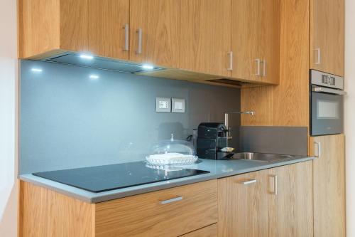 a kitchen with a counter top and a sink at D'Azeglio & Galluzzi Suites in Bologna