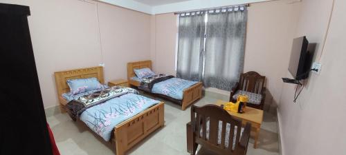 Una cama o camas en una habitación de The Himalayan Nest