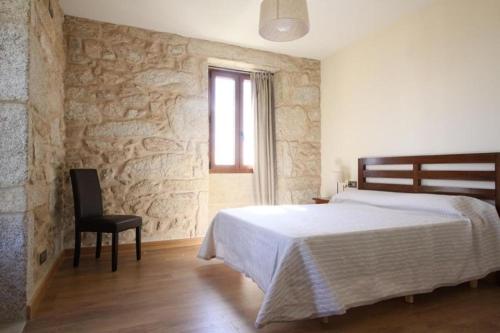 A bed or beds in a room at Camino de Rosa's