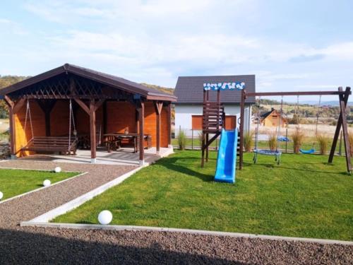 a playground with a pavilion and a swing at Domki z Widokiem in Wünschelburg