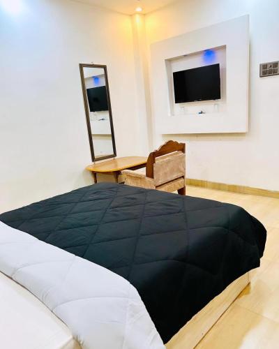 מיטה או מיטות בחדר ב-JMD PALACE