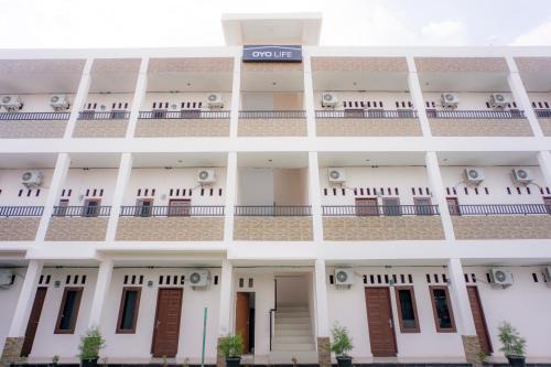 an external view of the building at OYO Life 2354 Rose House in Medan