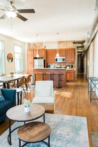 a living room with a couch and a table at The Penthouse- Heart of OTR w/Rooftop Terrace in Cincinnati