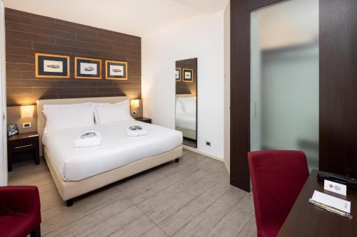 Postel nebo postele na pokoji v ubytování Best Western Plus Hotel Modena Resort