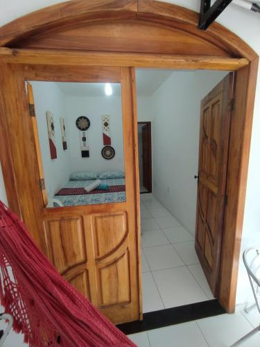 a room with a small room with a door at Pousada Luzena in Morro de São Paulo