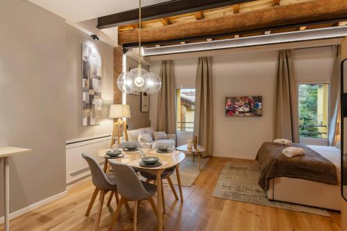 a living room with a bed and a table and chairs at Borgo Rotondo in San Giovanni in Persiceto