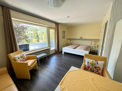 Postel nebo postele na pokoji v ubytování Hotel Sonnenhof Garni