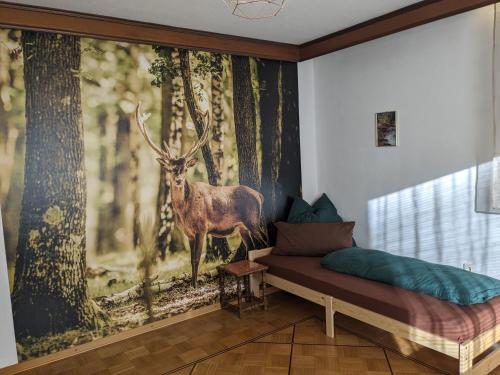 a room with a painting of a deer in the woods at WaldHausen, kostenfrei WLAN und Netflix in Momlingen