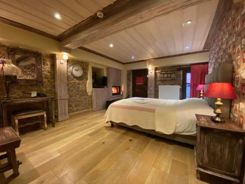 מיטה או מיטות בחדר ב-Alexandros Guesthouse