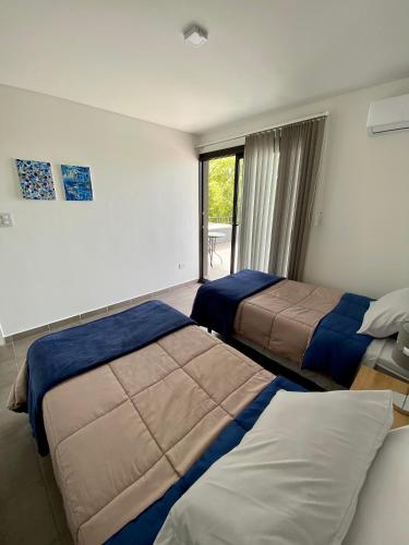 Postel nebo postele na pokoji v ubytování Departamento Cordillera II