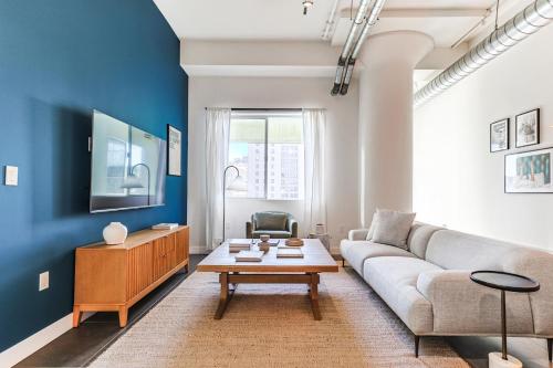 a living room with a couch and a table at Sunny & Spacious 2BDR & 1BTH in Downtown LA in Los Angeles