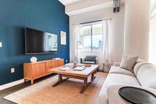 a living room with a couch and a table at Sunny & Spacious 2BDR & 1BTH in Downtown LA in Los Angeles