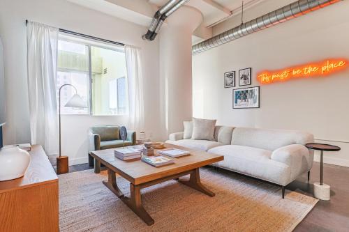 a living room with a couch and a table at Sunny & Spacious 2BDR & 1BTH in Downtown LA in Los Angeles