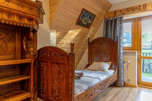 Posteľ alebo postele v izbe v ubytovaní Apartamenty i pokoje gościnne Wajdówka