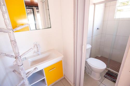 a bathroom with a sink and a toilet at Bela Mare Buzios in Búzios