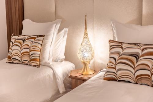 Letto o letti in una camera di Riad Nyla Wellness and Spa