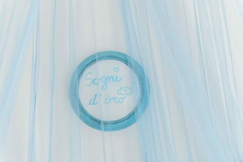 a sign on a white curtain with the words sew diy at Hotel Smart Cervia B&B in Cervia