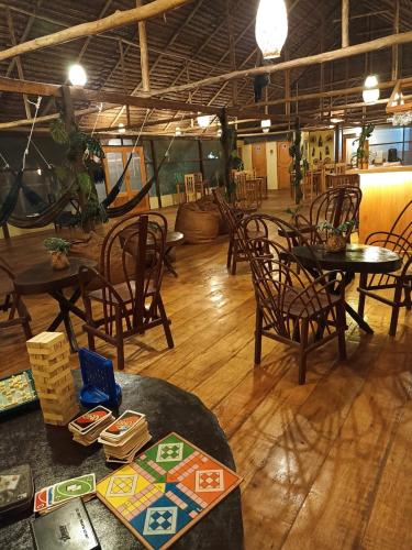 a dining room with tables and chairs in a building at Avatar Amazon Lodge & Canopy Park in Santa Teresa