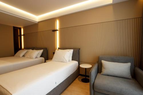 Katil atau katil-katil dalam bilik di Caramel Boutique Hotel