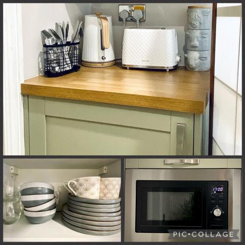a kitchen with a counter with a microwave and plates at Durham City Retreat in Durham