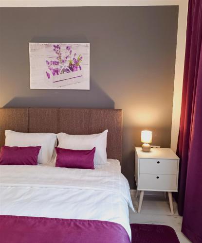 Ένα ή περισσότερα κρεβάτια σε δωμάτιο στο Apartments Ajša