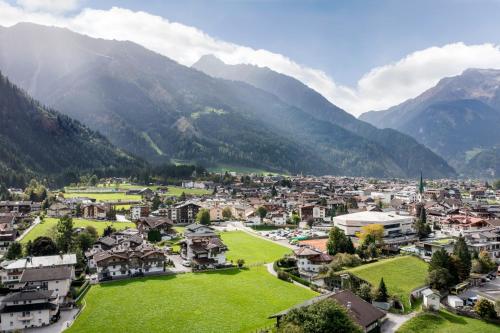 an aerial view of a village in the mountains at S'Dörfl Chalets in Mayrhofen
