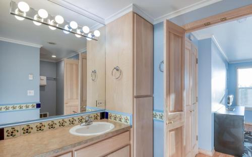 a bathroom with a sink and a mirror at Agate Beach Oceanfront Suite B in Newport