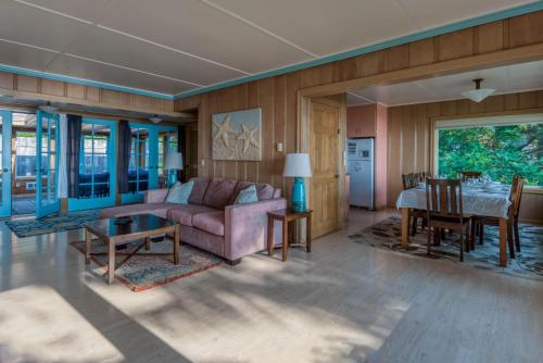 a living room with a couch and a table at Agate Beach Oceanfront Lodge in Newport