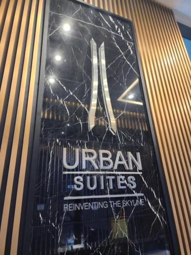 a sign for an urban suites influencing the style at Executive Premium Urban Suites - Jelutong in Jelutong