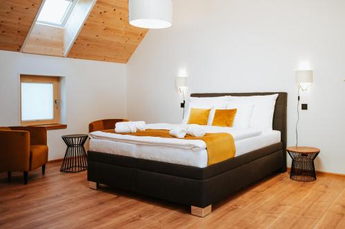 a bedroom with a large bed in a room at Galerie mlýn Žeraviny in Žeraviny