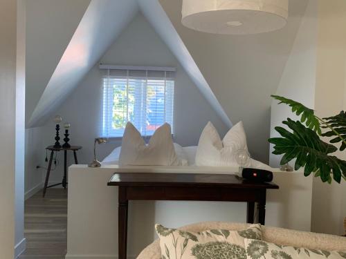 Zolder appartement Le Grenierにあるベッド