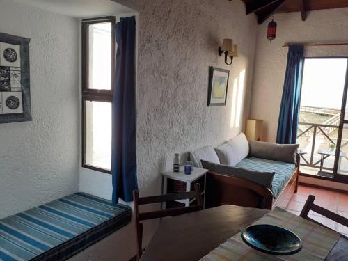 a living room with a couch and a table at Apto frente al mar en La paloma in La Paloma