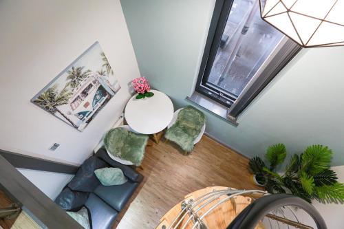 an overhead view of a living room with a table and chairs at B103 Urban Oasis loft in Coventry