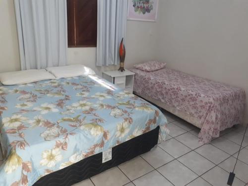 a bedroom with a bed and a bed sidx sidx sidx sidx at Pousada Hostel Villa Bella Mar in Natal