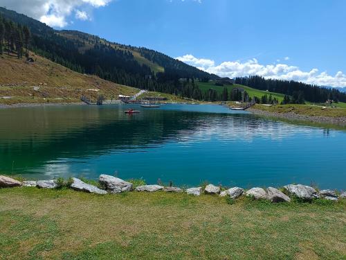a large lake with rocks in the middle of it at APPARTEMENT EBERHARTER Conny in Zell am Ziller