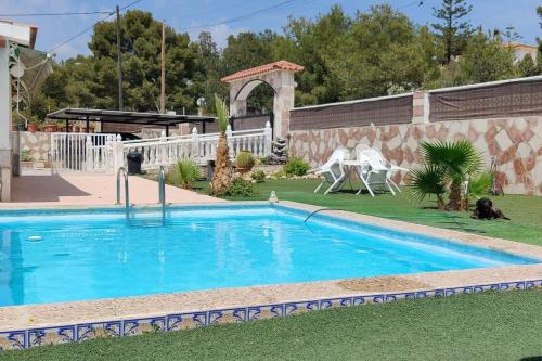 a swimming pool in the yard of a house at Villa Noah in Moralet
