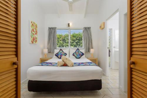 Postel nebo postele na pokoji v ubytování Rarotonga Daydreamer Escape