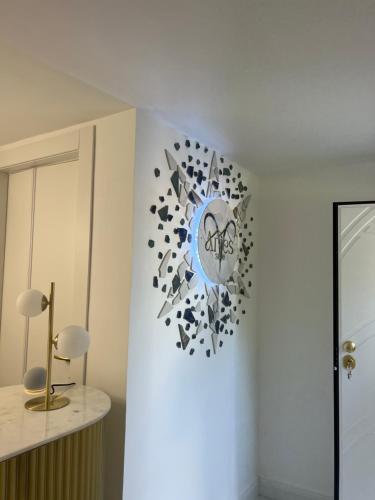 a clock on a wall in a room at Aries Suite Pompei in Pompei