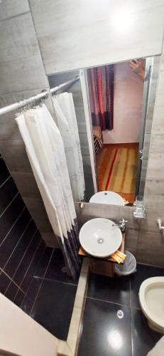 a bathroom with a sink and a mirror at Casa Mirador guesthouse in Cusco