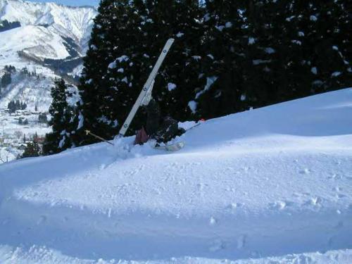 a pair of skis on top of a snow covered slope at STI SKI LODGE in Seki