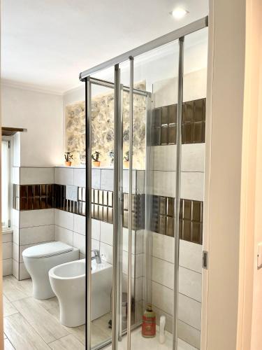 a bathroom with a toilet and a sink at Dimora di Charme Rooms & Apartments in Peschiera del Garda