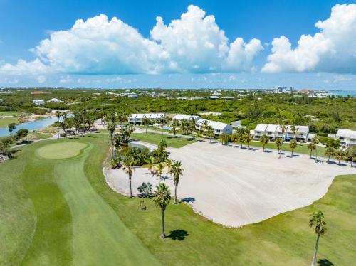 an aerial view of the golf course at the resort at 10 The Enclave in Providenciales